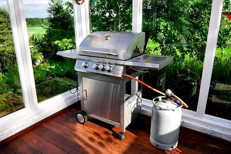 Potential risks of using a gas grill under a covered porch